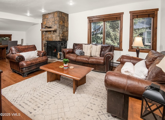 83 Larkspur Ln Unit A, Avon, CO 81620 - living area with light wood-style floors and a fireplace