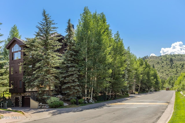 74 Cresta Rd Unit 110, Edwards, CO 81632 - view of asphalt road featuring curbs