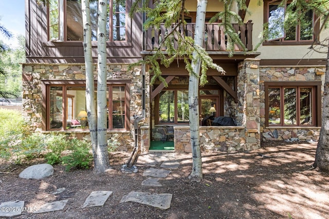 74 Cresta Rd Unit 110, Edwards, CO 81632 - back of property featuring stone siding, a balcony, and stucco siding