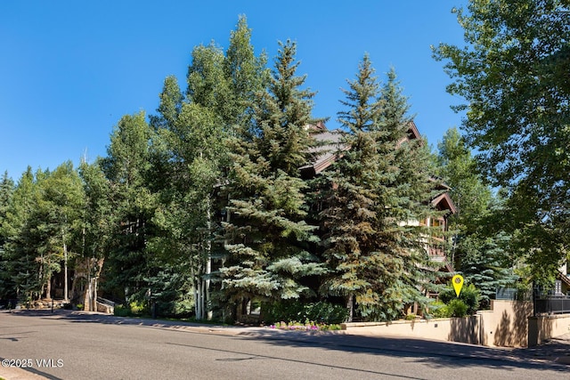 74 Cresta Rd Unit 110, Edwards, CO 81632 - view of asphalt road featuring traffic signs