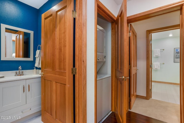 74 Cresta Rd Unit 110, Edwards, CO 81632 - bathroom featuring stacked washer / drying machine and vanity