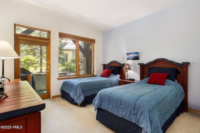 74 Cresta Rd Unit 110, Edwards, CO 81632 - bedroom with light carpet and access to outside