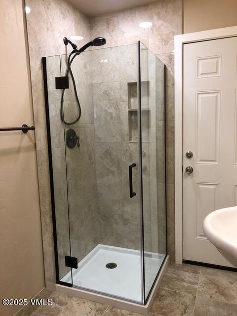 bathroom with a shower stall