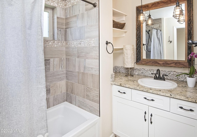 full bath featuring shower / bath combo with shower curtain and vanity