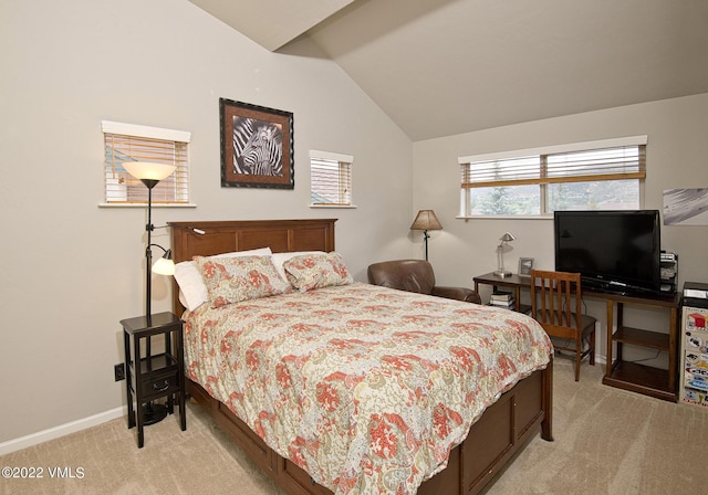 bedroom featuring light colored carpet, baseboards, and vaulted ceiling