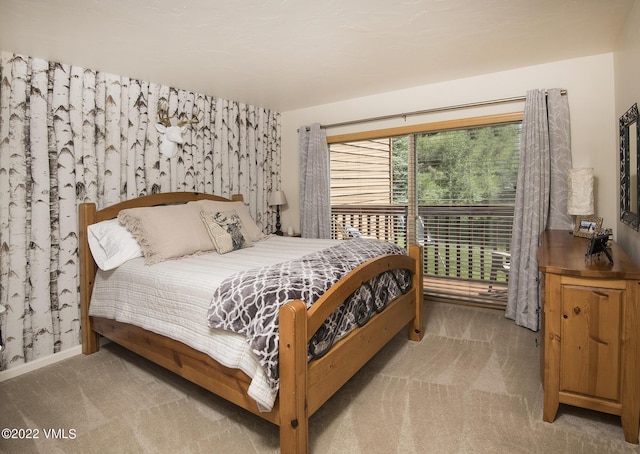 bedroom featuring wallpapered walls, carpet flooring, and baseboards