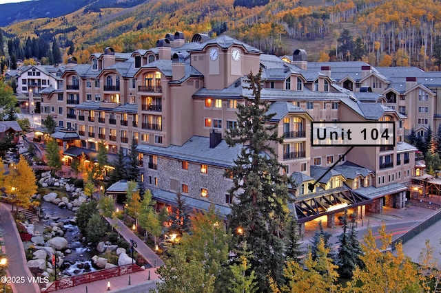 26 Avondale Ln Unit 104-H, Beaver Creek, CO 81620 - view of building exterior featuring a wooded view and a mountain view