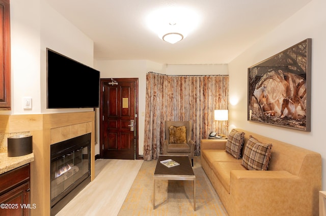 26 Avondale Ln Unit 104-H, Beaver Creek, CO 81620 - living area featuring a tiled fireplace
