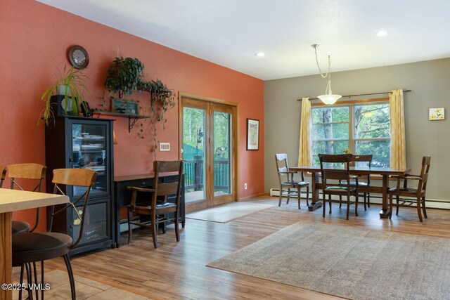 445 Pine St, Red Cliff, CO 81649 - dining room featuring healthy amount of natural light, wood finished floors, recessed lighting, french doors, and baseboard heating