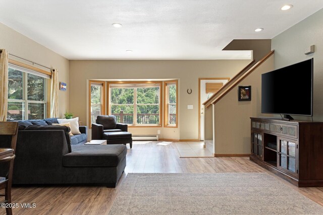 445 Pine St, Red Cliff, CO 81649 - living room featuring wood finished floors, a baseboard radiator, and recessed lighting