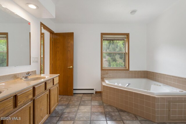 445 Pine St, Red Cliff, CO 81649 - bathroom featuring baseboard heating, a bath, double vanity, and plenty of natural light