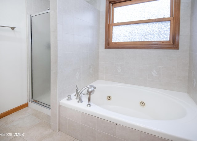 bathroom with separate shower and tub and tile patterned floors