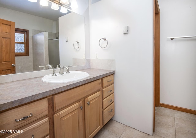 bathroom featuring tile patterned floors, vanity, and walk in shower