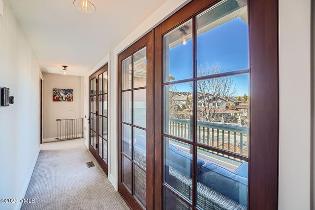50 Bunker Way, Eagle, CO 81631 - hallway featuring french doors, baseboards, light colored carpet, and visible vents