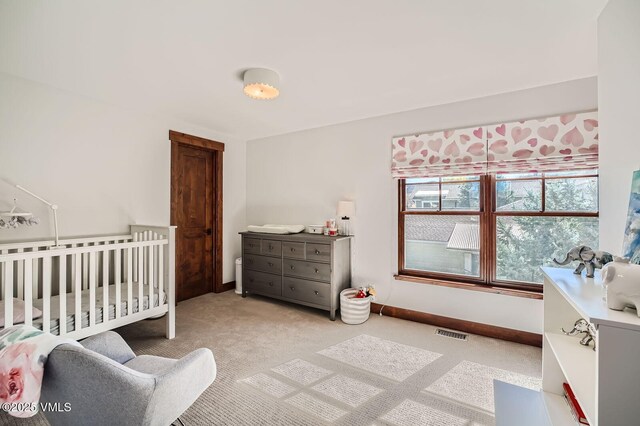 50 Bunker Way, Eagle, CO 81631 - bedroom with light carpet, a nursery area, baseboards, and visible vents
