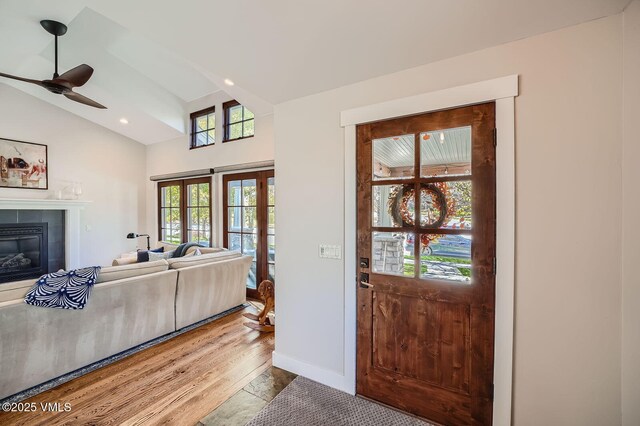 50 Bunker Way, Eagle, CO 81631 - foyer with lofted ceiling, recessed lighting, a ceiling fan, a tile fireplace, and wood finished floors