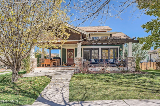 50 Bunker Way, Eagle, CO 81631 - craftsman-style house with a front yard, stone siding, fence, a shingled roof, and a porch