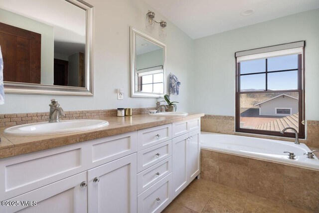 50 Bunker Way, Eagle, CO 81631 - bathroom with double vanity, a sink, a garden tub, and tile patterned floors