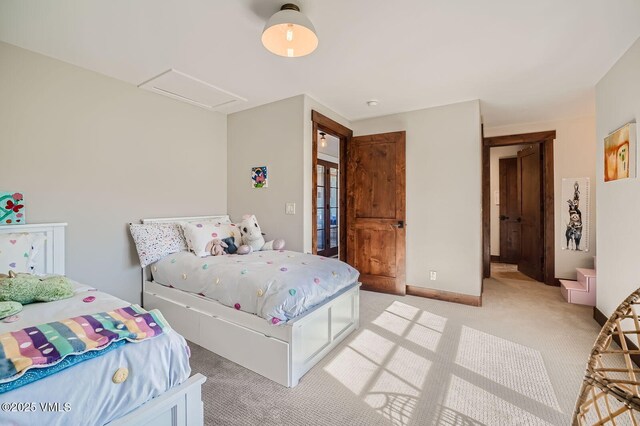 50 Bunker Way, Eagle, CO 81631 - bedroom featuring baseboards, attic access, and light colored carpet