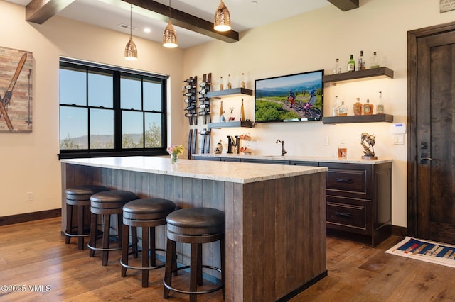 620 Jouflas Ranch Rd, Wolcott, CO 81655 - indoor wet bar featuring beam ceiling, dark wood-style floors, decorative light fixtures, and recessed lighting