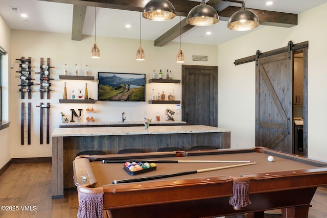 620 Jouflas Ranch Rd, Wolcott, CO 81655 - playroom featuring beamed ceiling, billiards table, wet bar, wood finished floors, and a barn door