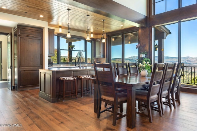 620 Jouflas Ranch Rd, Wolcott, CO 81655 - dining area with dark wood finished floors, healthy amount of natural light, recessed lighting, wood ceiling, and a mountain view