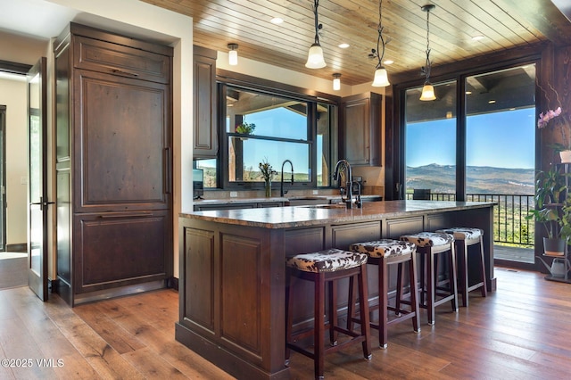620 Jouflas Ranch Rd, Wolcott, CO 81655 - bar featuring wooden ceiling, dark wood-style flooring, and hanging light fixtures