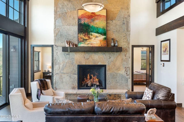 620 Jouflas Ranch Rd, Wolcott, CO 81655 - living area with a towering ceiling, wood finished floors, and a fireplace
