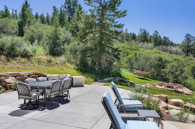 620 Jouflas Ranch Rd, Wolcott, CO 81655 - view of patio featuring outdoor dining area and a view of trees