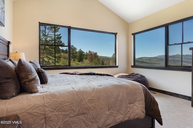 620 Jouflas Ranch Rd, Wolcott, CO 81655 - bedroom with carpet, multiple windows, vaulted ceiling, and a mountain view