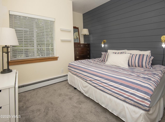 175 Hurd Ln Unit 3101, Avon, CO 81620 - bedroom with carpet flooring, a baseboard radiator, and wood walls