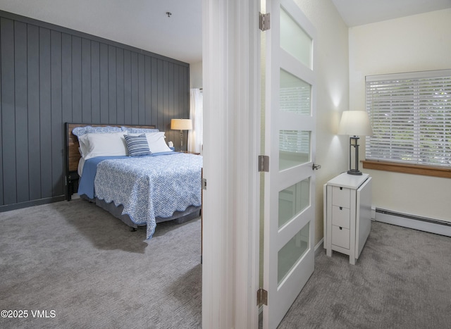 175 Hurd Ln Unit 3101, Avon, CO 81620 - carpeted bedroom featuring wood walls, a baseboard heating unit, and baseboards