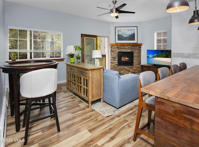 175 Hurd Ln Unit 3101, Avon, CO 81620 - living area with a fireplace, light wood finished floors, and ceiling fan
