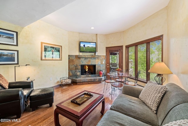 411 Eagle Dr Unit 10, Eagle-Vail, CO 81620 - living area featuring a stone fireplace and wood finished floors