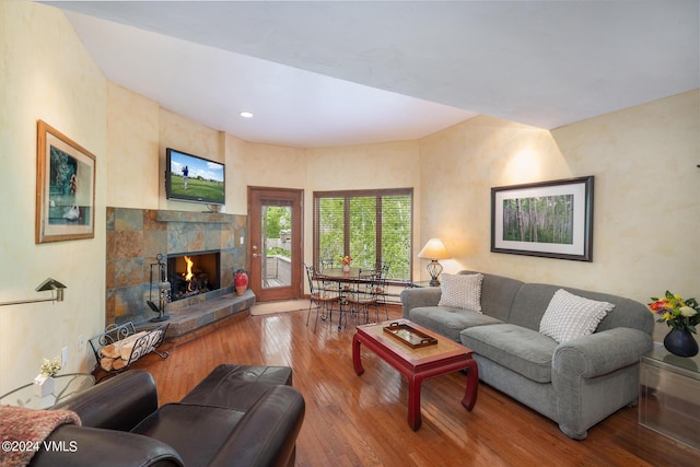 411 Eagle Dr Unit 10, Eagle-Vail, CO 81620 - living room with wood-type flooring and a warm lit fireplace