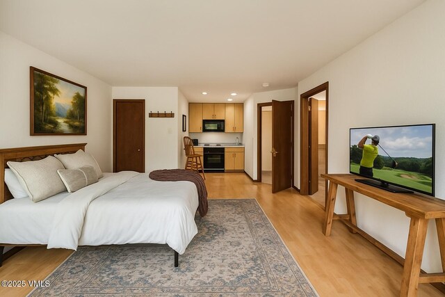 411 Eagle Dr Unit 10, Eagle-Vail, CO 81620 - bedroom featuring access to exterior, a tile fireplace, and wood finished floors