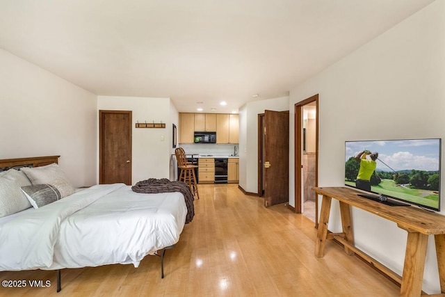 411 Eagle Dr Unit 10, Eagle-Vail, CO 81620 - bedroom featuring light wood finished floors, recessed lighting, and connected bathroom