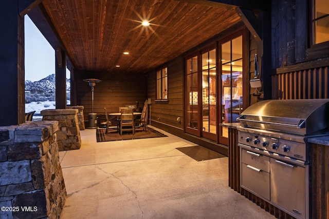 93 S Penstemon Ln, Eagle, CO 81631 - kitchen with stainless steel appliances, vaulted ceiling, a sink, decorative backsplash, and brown cabinetry