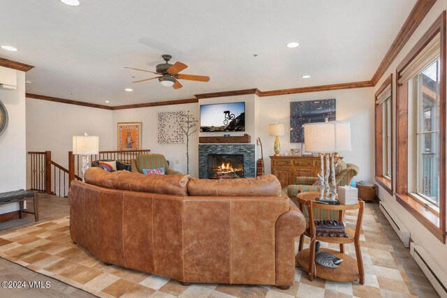 living room featuring a baseboard heating unit and ornamental molding