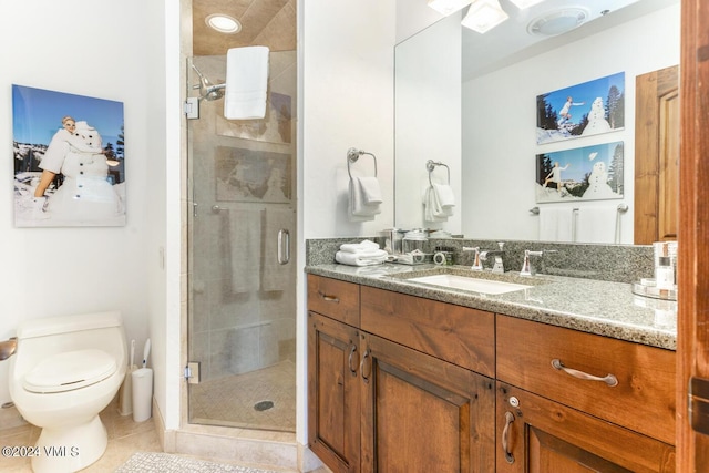 bathroom featuring vanity, toilet, tile patterned floors, and a shower with shower door