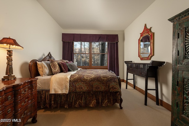 carpeted bedroom with baseboards