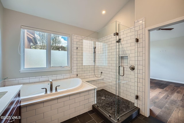 2900 June Creek Trl Unit B, Avon, CO 81620 - bathroom featuring a garden tub, a shower stall, vaulted ceiling, vanity, and recessed lighting