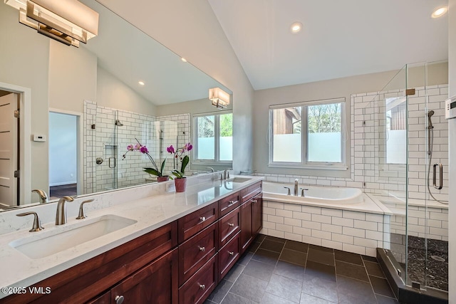 2900 June Creek Trl Unit B, Avon, CO 81620 - full bathroom with lofted ceiling, a stall shower, a garden tub, double vanity, and recessed lighting