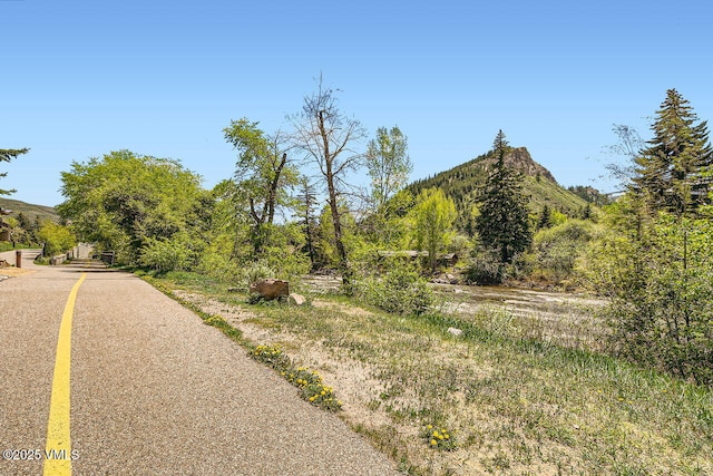 126 Riverfront Ln Unit 438, Avon, CO 81620 - view of asphalt street with a mountain view