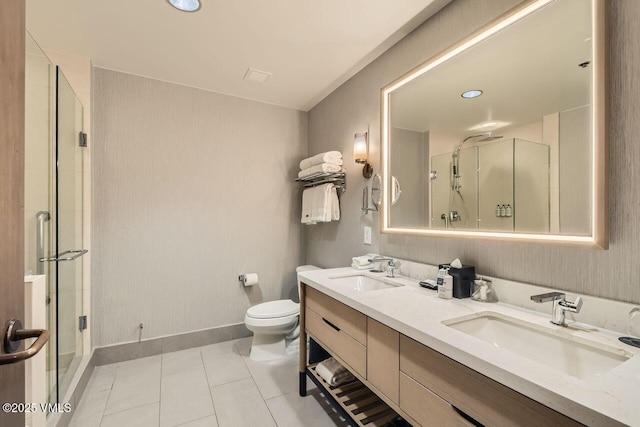 126 Riverfront Ln Unit 438, Avon, CO 81620 - bathroom featuring a stall shower, toilet, double vanity, tile patterned flooring, and baseboards