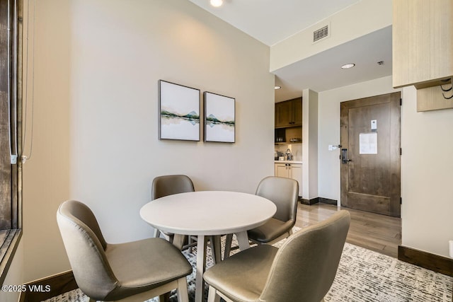 126 Riverfront Ln Unit 438, Avon, CO 81620 - dining space featuring light wood-style floors, recessed lighting, and baseboards