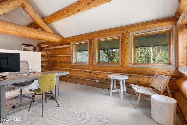 office featuring lofted ceiling with beams, light colored carpet, and rustic walls