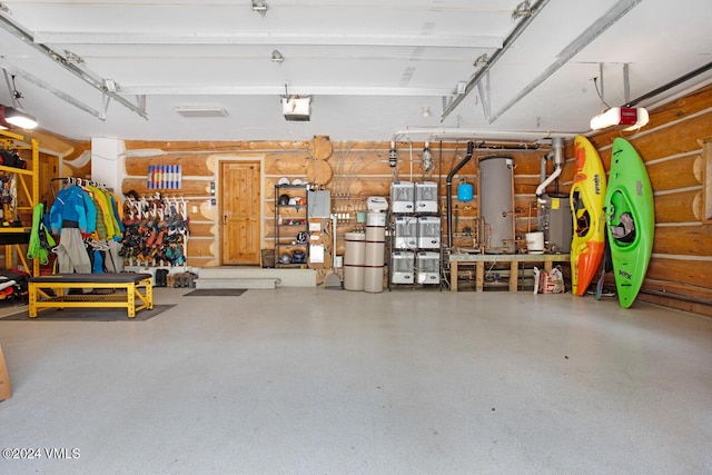 garage featuring a garage door opener, gas water heater, and a workshop area