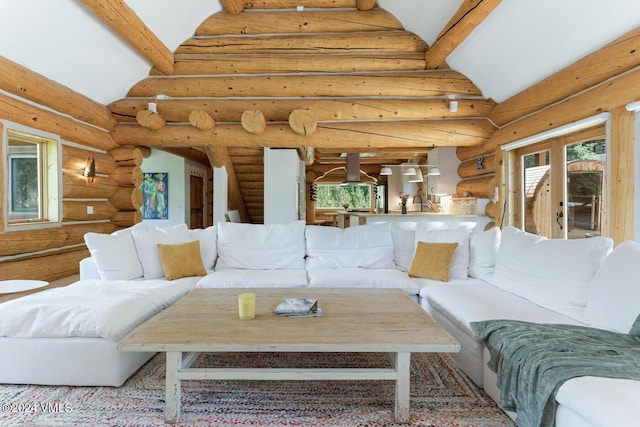 living room with high vaulted ceiling and french doors