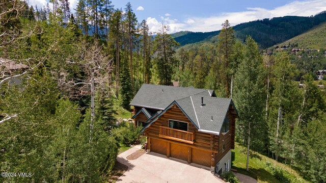 birds eye view of property featuring a mountain view